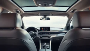 Luxury sedan interior dashboard with premium leather seats and advanced infotainment system, modern minimalist design, natural lighting through panoramic window, automotive photography studio setting