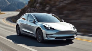 Tesla Model 3 Performance silver sedan in motion on winding mountain road with blurred background, showcasing sleek aerodynamic profile and modern design language