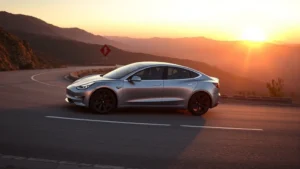 Sleek silver Tesla Model 3 Performance sedan on winding mountain road at sunset, showcasing aerodynamic profile and performance stance