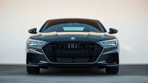 Sleek luxury sedan with aggressive front grille and sharp LED headlights, professional automotive photography, neutral background, daytime lighting, premium German engineering aesthetic