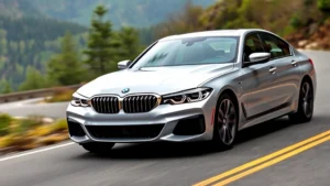 Sleek silver BMW M440i xDrive sedan photographed from a three-quarter front angle on a winding mountain road with blurred forest background, showcasing athletic stance and modern LED headlights