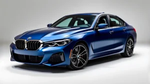 2024 BMW M440i xDrive sedan photographed from three-quarter angle showing aggressive front grille, sleek profile, premium alloy wheels, metallic blue finish with professional studio lighting