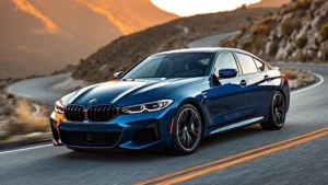 2024 BMW M440i xDrive sedan in metallic blue, three-quarter front angle, aggressive sport styling, modern luxury design, on winding mountain road, golden hour lighting