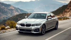 2024 BMW 3 Series sedan in metallic silver, photographed from three-quarter front angle on a mountain road with blurred landscape background, showcasing refined proportions and modern headlight design