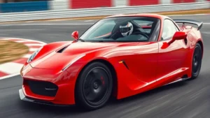 Professional automotive photographer capturing bright red sports car accelerating on closed circuit track with motion blur and professional racing driver visible through windshield