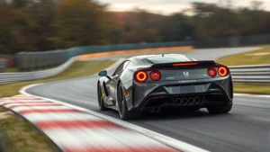 High-performance sports car accelerating on a race track, motion blur background, dynamic perspective, professional automotive photography