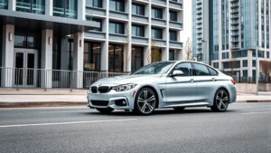Silver BMW M440i xDrive sedan parked on modern urban street with contemporary architecture in background, professional automotive photography